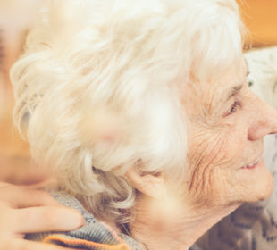 Young woman hugging a senior