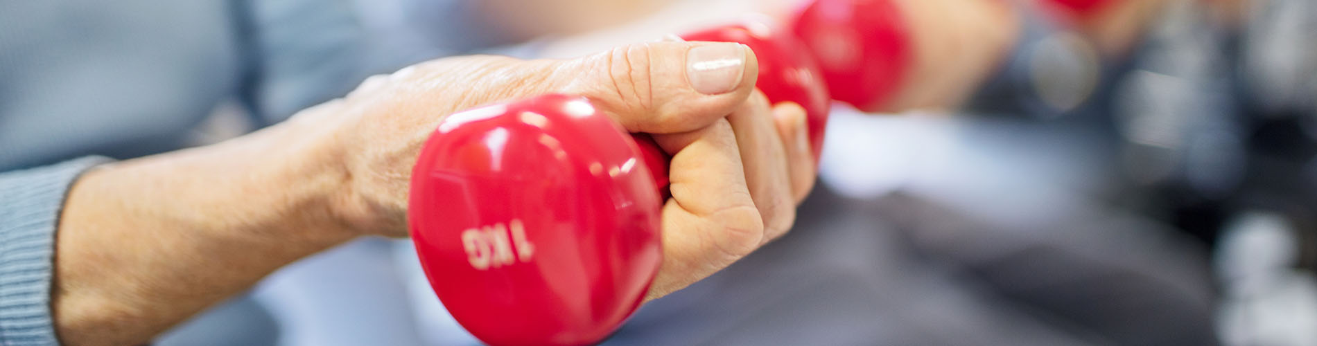 Older woman lifting weights
