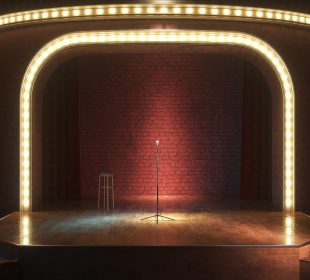 Dark empty stage with microphone
