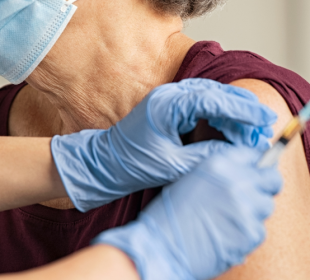Elderly woman getting COVID vaccine