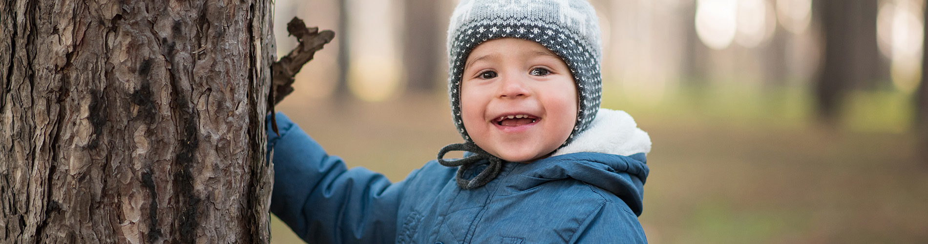 Toddler Playing Outdoors in Cold Weather