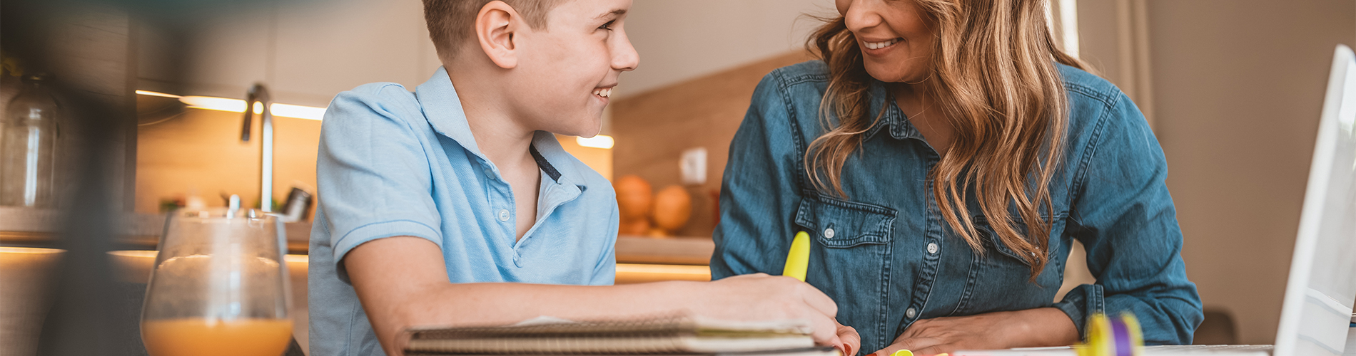 teacher helping boy with homework