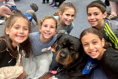 kids at Mitzvah Mutts with Lucy the Rottweiler