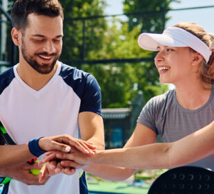 Young adults playing pickleball