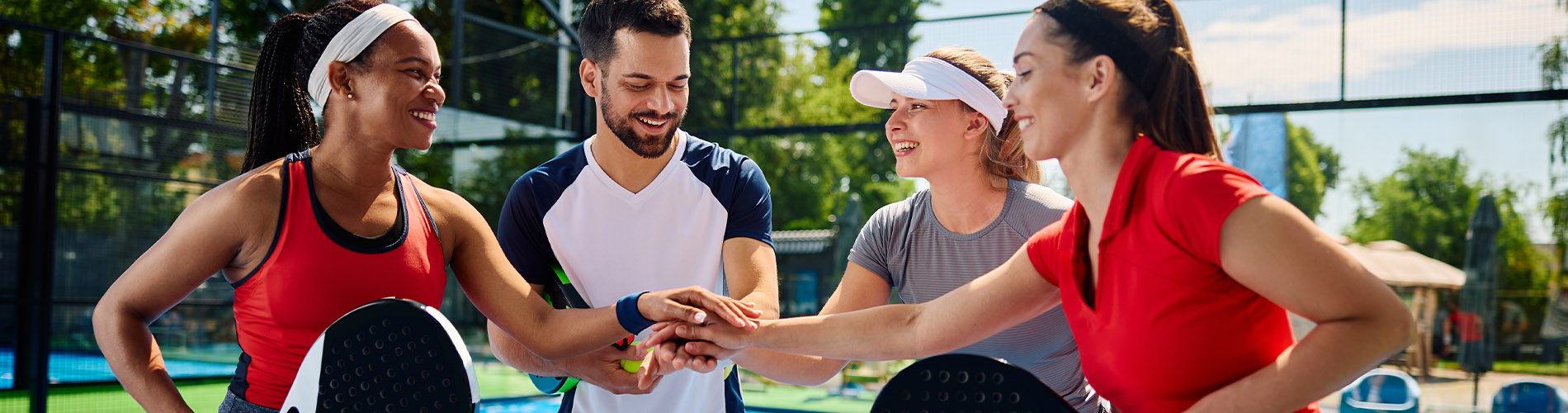 Young adults playing pickleball