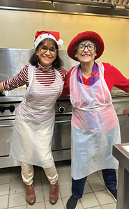 Lisa Gallina and friend volunteering in a kitchen