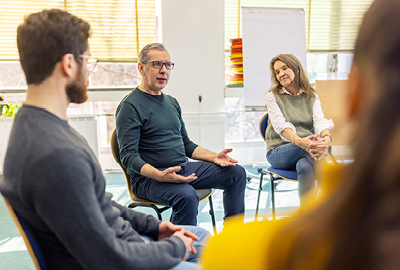 Mature man discussing his mental health difficulties with the support group