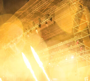 a music festival stage with bright lights