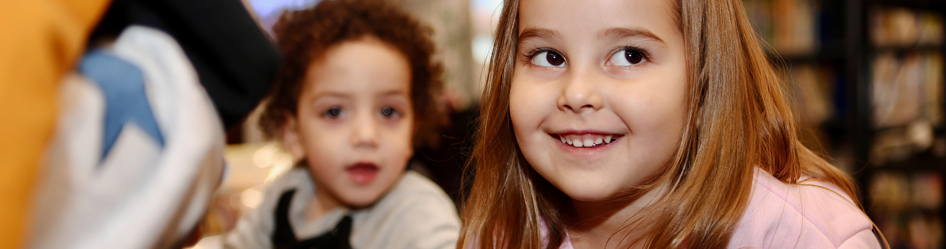 Smiling children at the Jewish Library of Baltimore