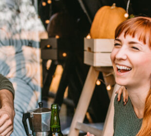 smiling friends enjoys food and conversation