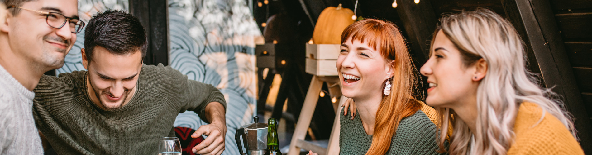 smiling friends enjoys food and conversation
