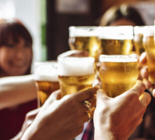 young adults cheers at happy hour