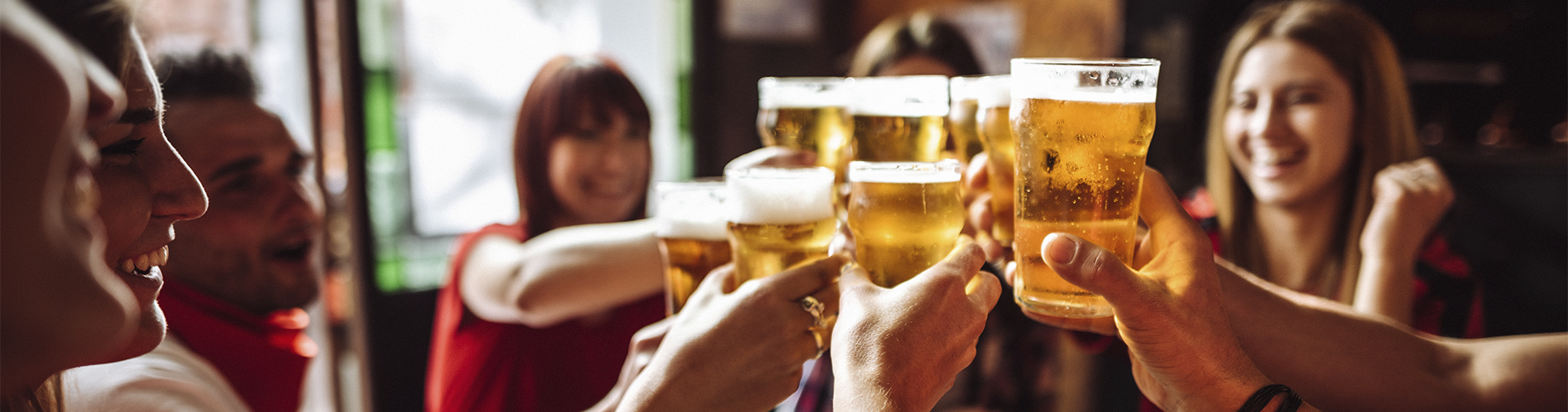 young adults cheers at happy hour