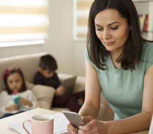 Mother staring at her phone