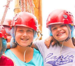 Little girls wearing helmets for zipline