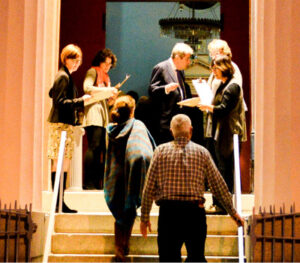 People walking up steps to synagogue