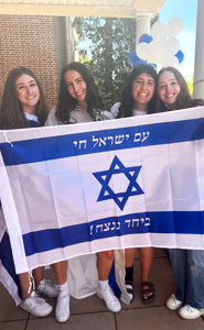 Cameron Fields with friends holding the Israel flag