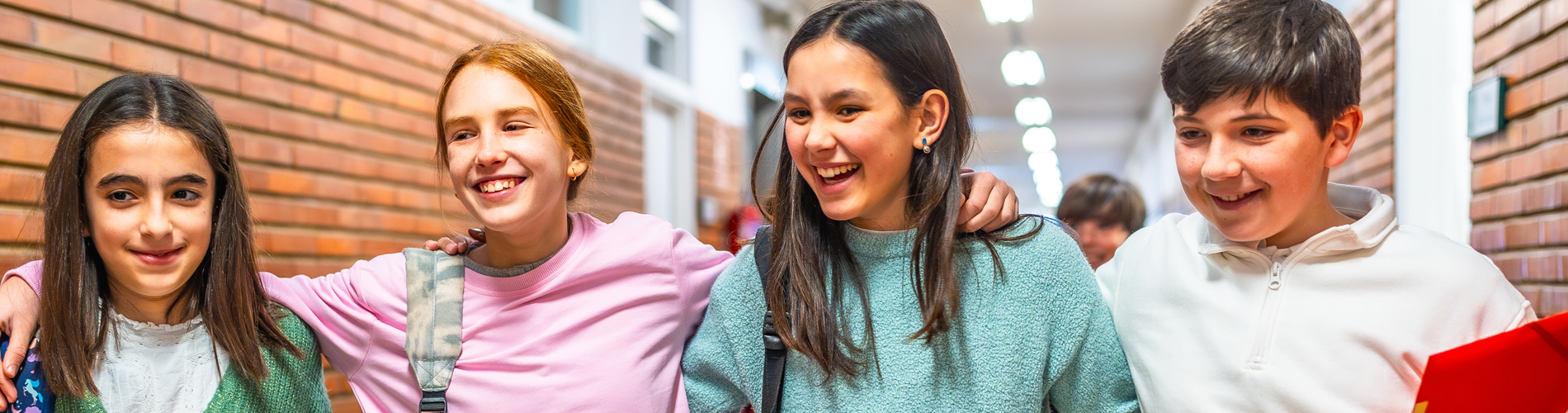 middle school students smiling at school