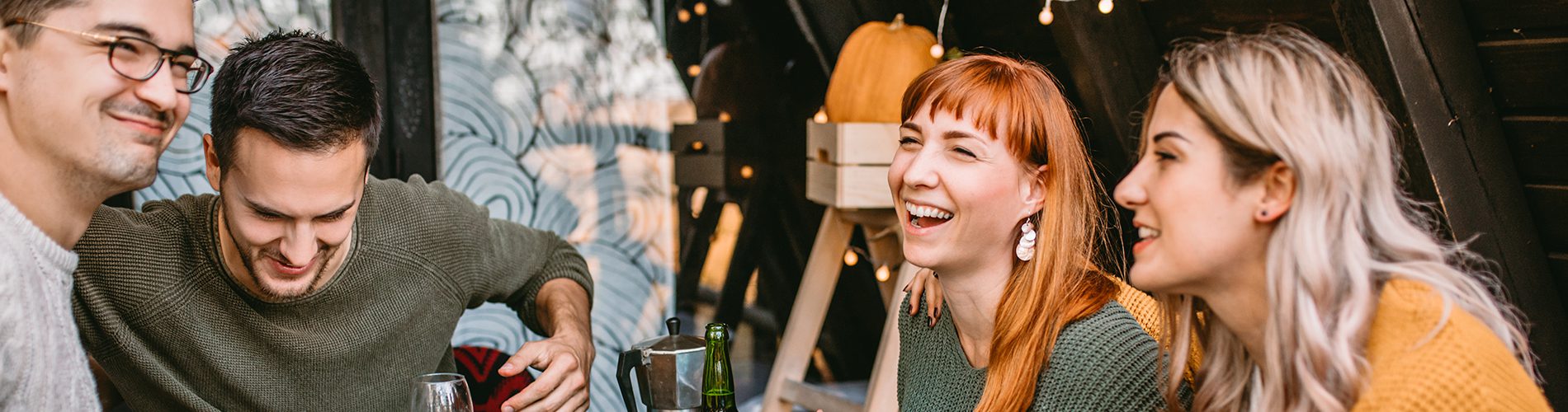 Young people eating dinner together