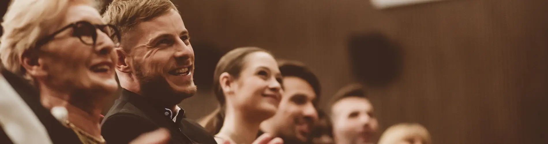 Audience at event clapping