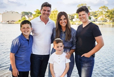 Gail Wealcatch with her husband and three sons