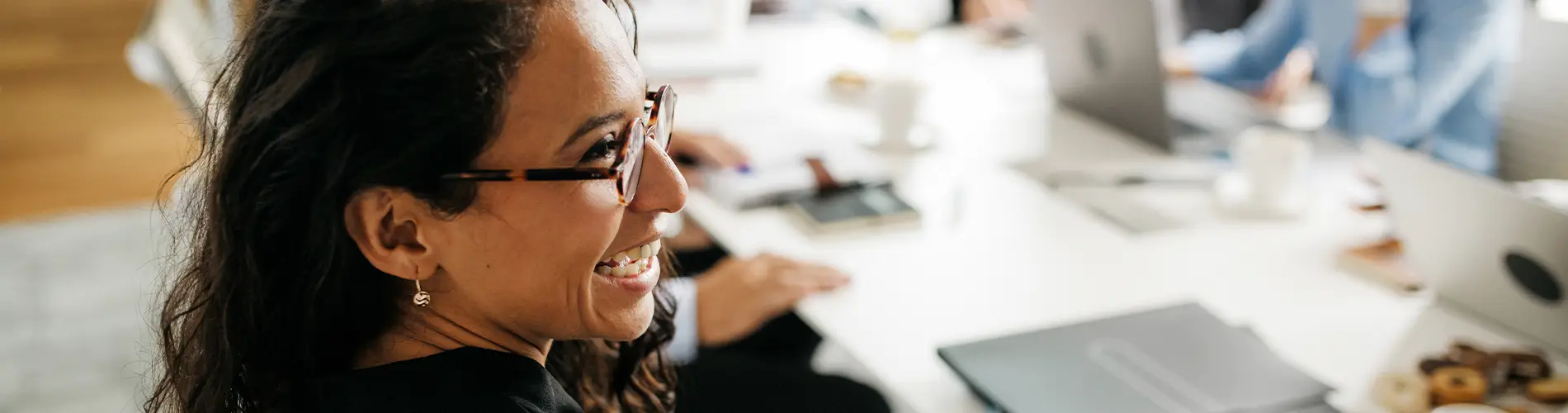 Professional woman smiling in meeting
