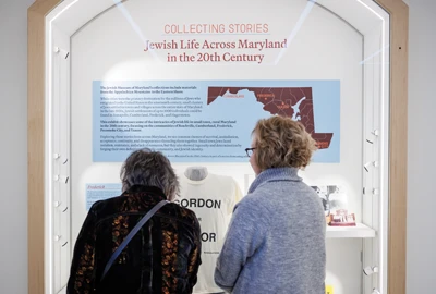 Two women looking at an exhibit at the newly renovated Jewish Museum of Maryland