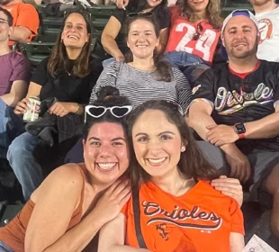 Young adults at the Orioles game