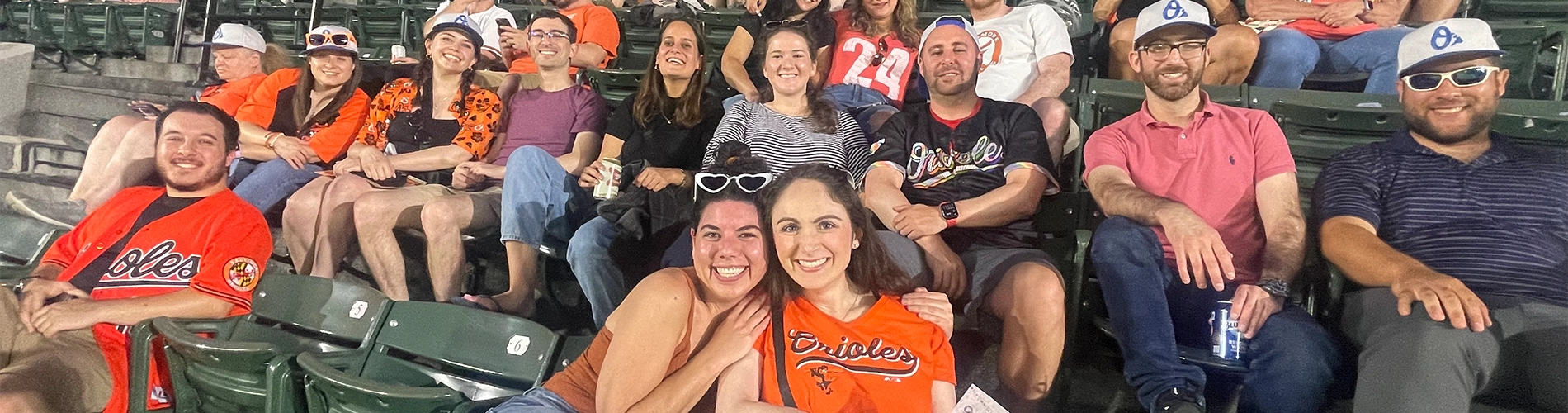 Young adults at the Orioles game