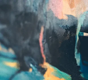 Person painting art on canvas