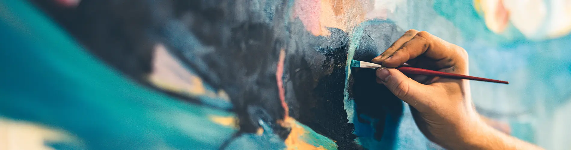 Person painting art on canvas