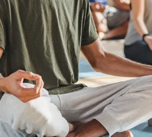 People meditating on yoga mats
