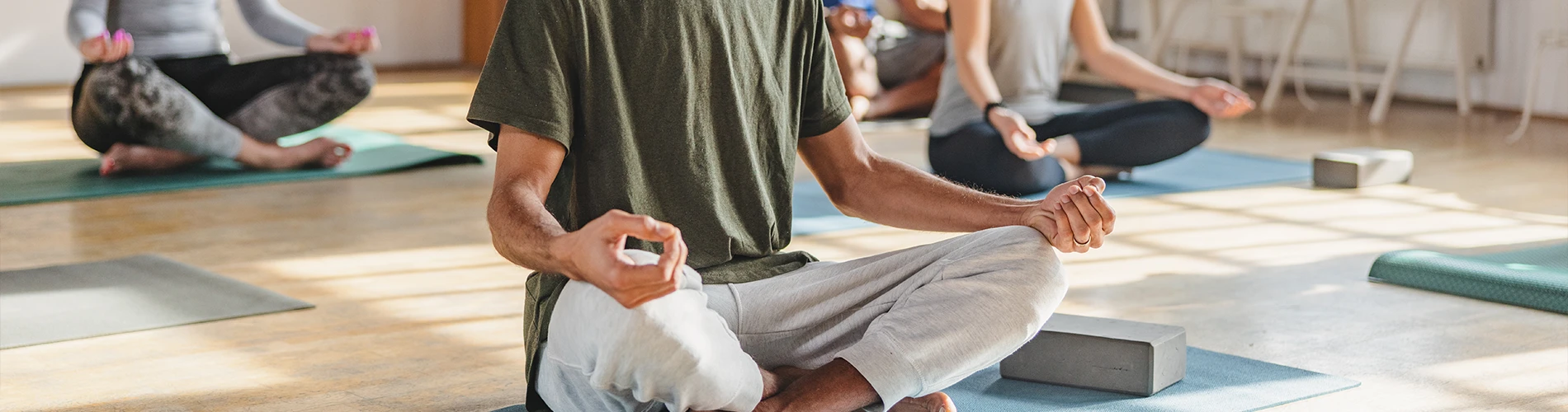 People meditating on yoga mats