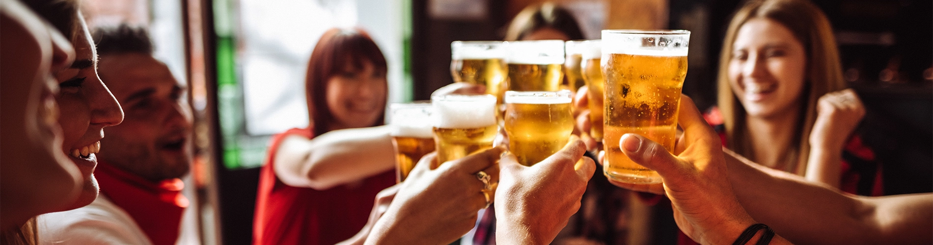 young adults cheers with beer
