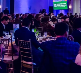 Audience members at an Associated event