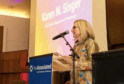 Karen Singer speaking at The Associated's LeadHERship event