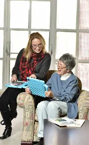 Melanie Waxman helping a senior woman with technology