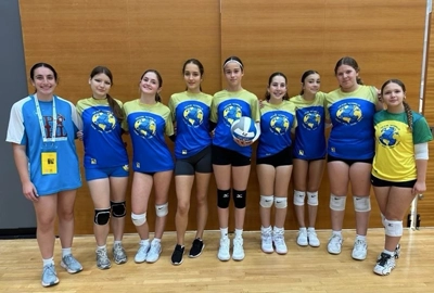 Alina from Odesa, Ukraine, at the Maccabi Games posing with her volleyball team.