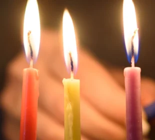 lighting chanukah candles