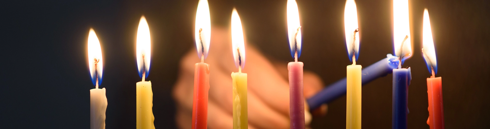 lighting chanukah candles