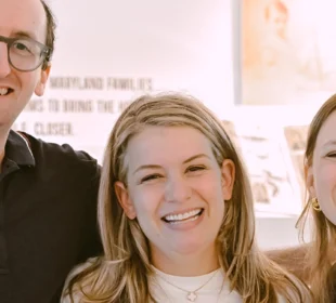 young adults smiling at an event