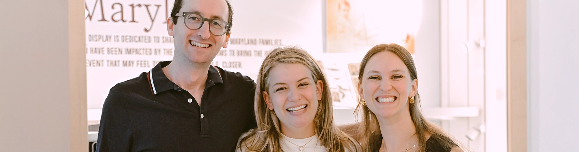 young adults smiling at an event