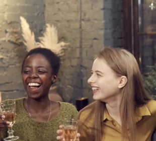 Diverse Group of Young People Enjoying Dinner Party