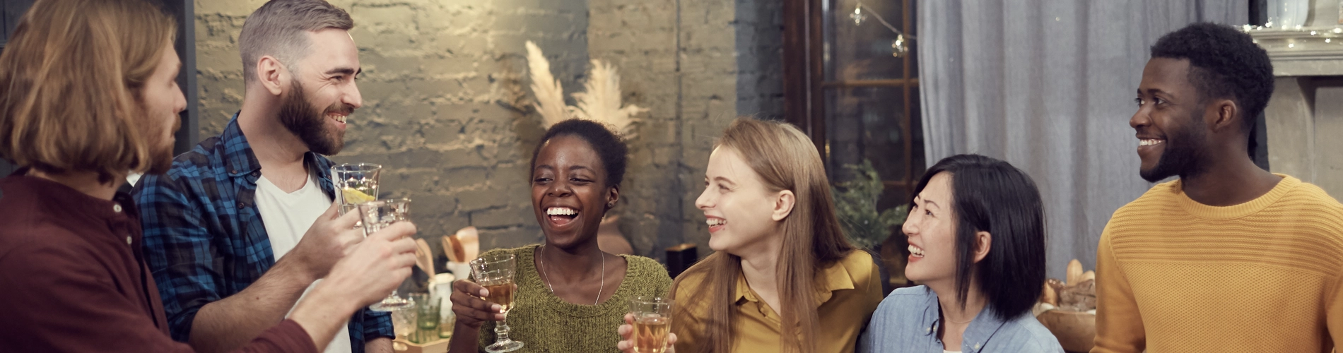 Diverse Group of Young People Enjoying Dinner Party