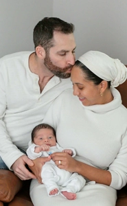 Lindsey Jeanniton with her husband and baby.