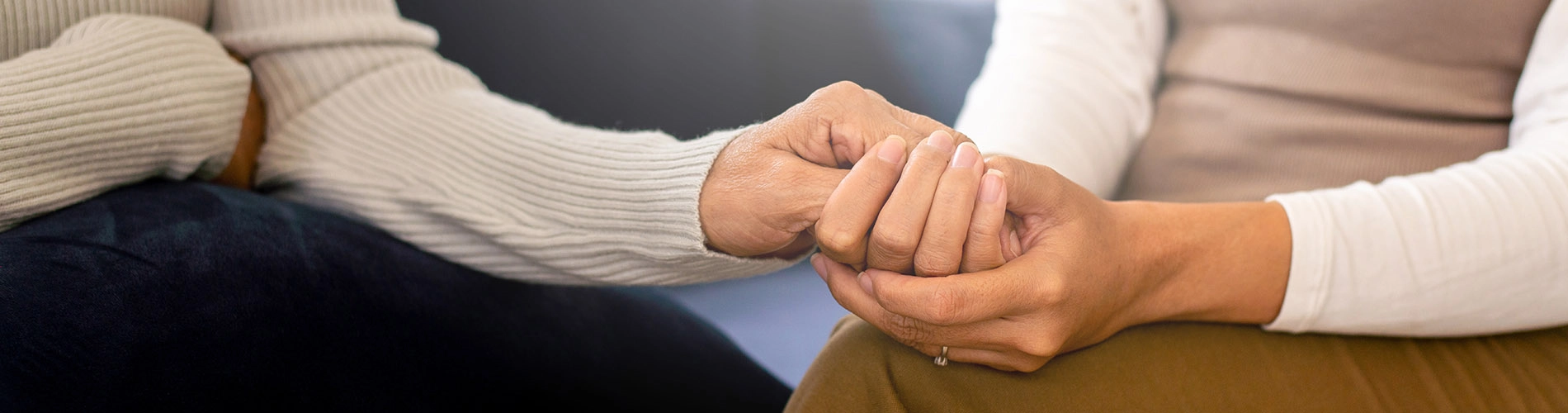 Women Offering Support by Holding Hands